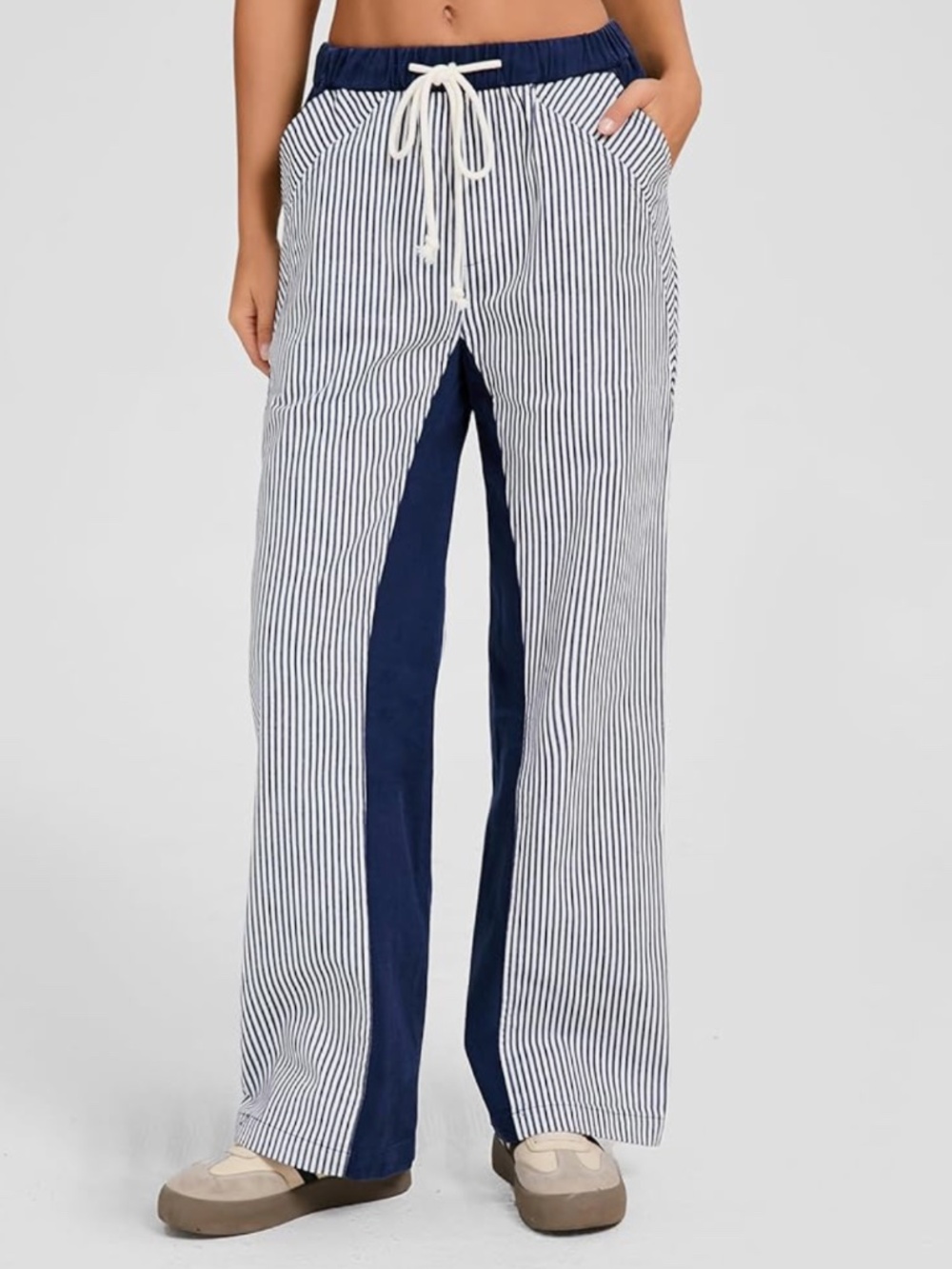 Lightweight wide-leg pants with vertical navy and white pinstripes. Navy center